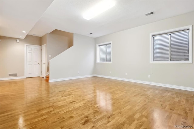 empty room with light hardwood / wood-style floors