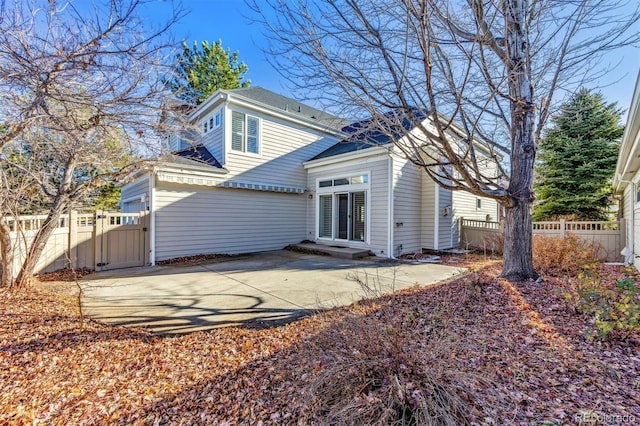 rear view of property with a patio area