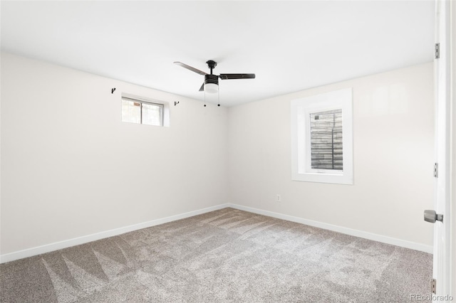 carpeted empty room featuring ceiling fan