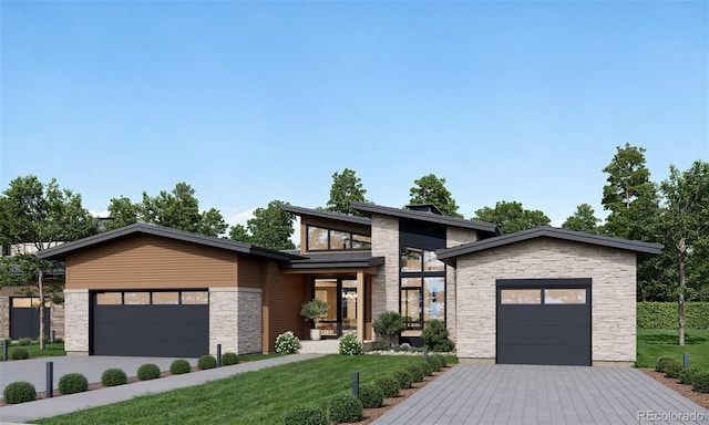 view of front of home featuring a front yard and a garage