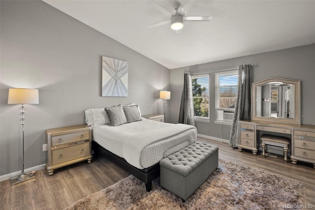 2970 Leoti Dr, Colorado Springs, CO 80922 - bedroom featuring vaulted ceiling, wood finished floors, baseboards, and a ceiling fan