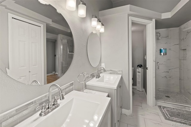 2970 Leoti Dr, Colorado Springs, CO 80922 - full bath featuring marble look tiles, a marble finish shower, vanity, and baseboards