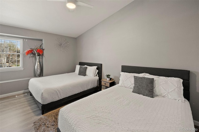 2970 Leoti Dr, Colorado Springs, CO 80922 - bedroom featuring lofted ceiling, wood finished floors, baseboards, and ceiling fan