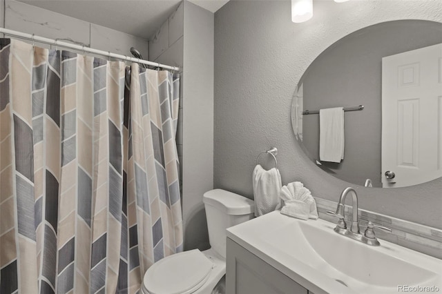 2970 Leoti Dr, Colorado Springs, CO 80922 - bathroom featuring toilet, vanity, and curtained shower