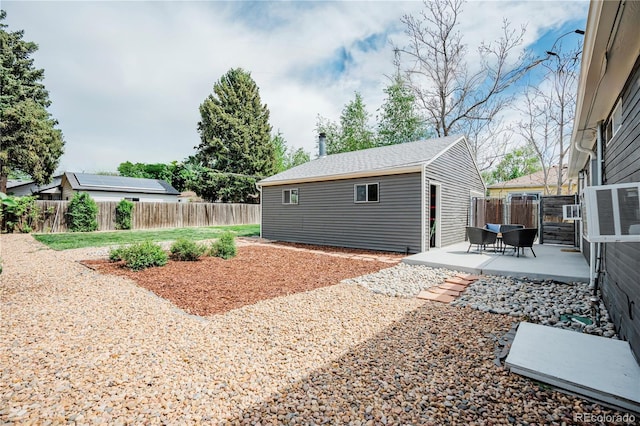 5108 S Pennsylvania St, Littleton, CO 80121 - fenced backyard featuring a patio and an outbuilding