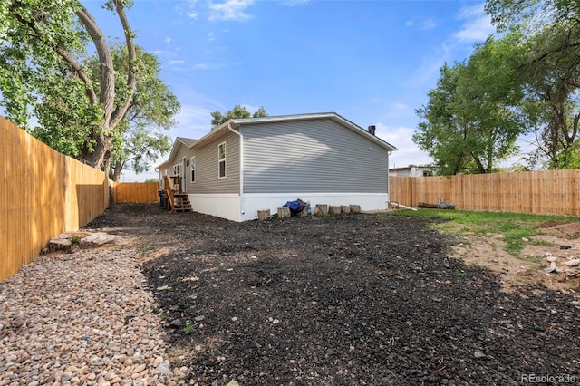 811 Plum Ave N, Lochbuie, CO 80603 - rear view of house featuring a fenced backyard