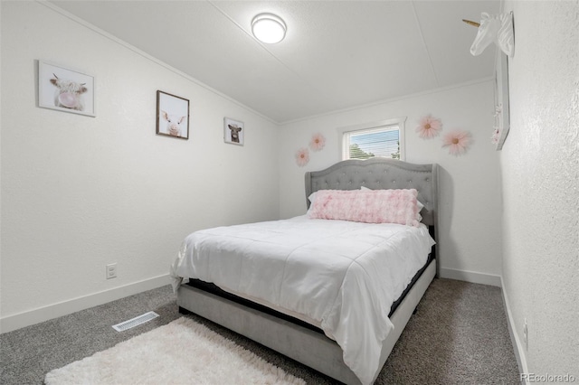 811 Plum Ave N, Lochbuie, CO 80603 - carpeted bedroom with lofted ceiling and crown molding