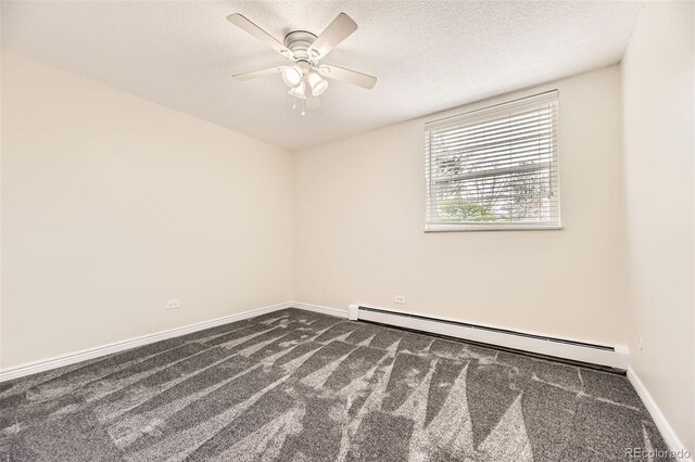 2160 S Vaughn Way Unit 104C, Aurora, CO 80014 - unfurnished room featuring a textured ceiling, ceiling fan, dark carpet, and a baseboard radiator