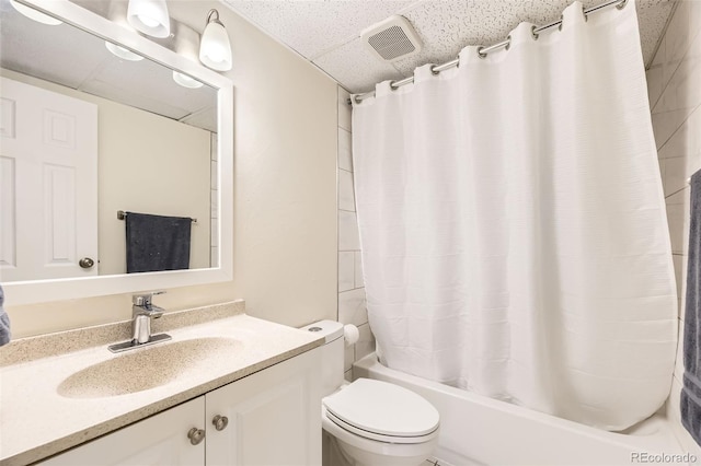 2160 S Vaughn Way Unit 104C, Aurora, CO 80014 - bathroom featuring vanity, shower / bath combo with shower curtain, toilet, a drop ceiling, and visible vents