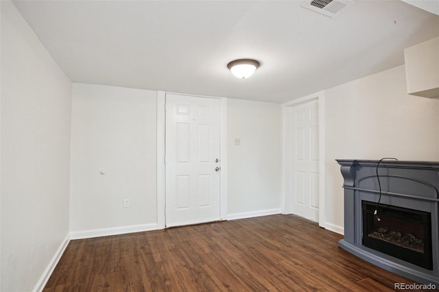 1301 Kenton St, Aurora, CO 80010 - unfurnished living room with wood finished floors and a fireplace