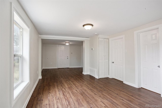 1301 Kenton St, Aurora, CO 80010 - empty room with dark wood-style flooring and baseboards