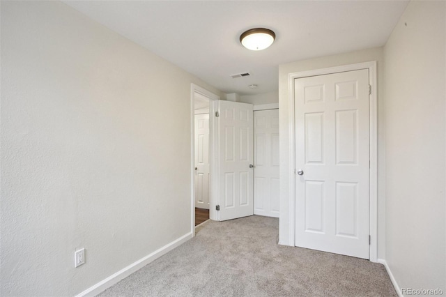 1301 Kenton St, Aurora, CO 80010 - unfurnished bedroom featuring carpet and a closet