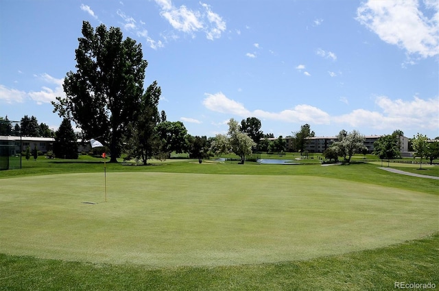 surrounding community featuring a lawn