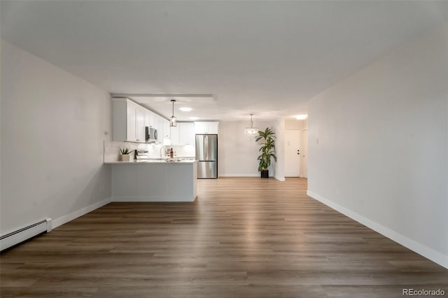 625 S Alton Way Unit 3A, Denver, CO 80247 - unfurnished living room featuring a baseboard radiator, dark wood-style floors, recessed lighting, and a chandelier