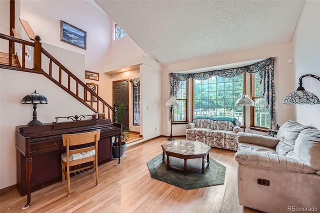 5362 S Danube Ct, Centennial, CO 80015 - living room featuring stairway, wood finished floors, and a textured ceiling
