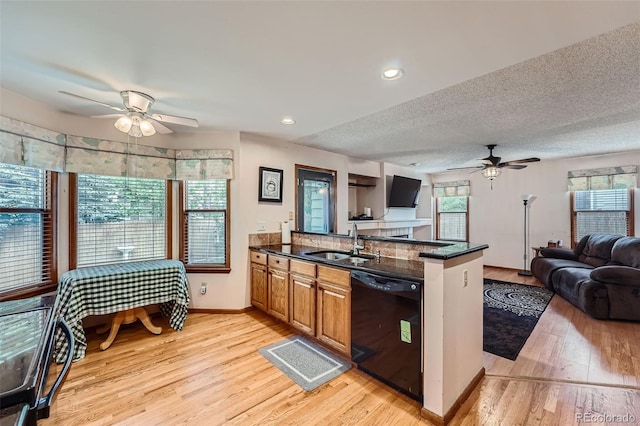 5362 S Danube Ct, Centennial, CO 80015 - kitchen featuring black dishwasher, ceiling fan, a peninsula, open floor plan, and light wood-type flooring