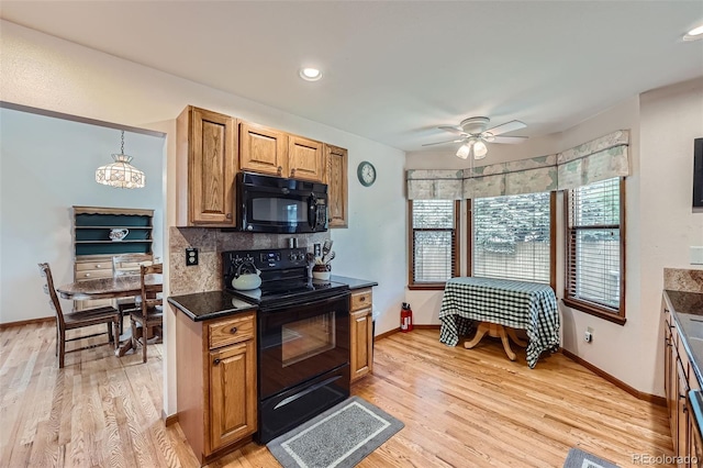 5362 S Danube Ct, Centennial, CO 80015 - kitchen with black appliances, light wood-style flooring, ceiling fan, backsplash, and brown cabinetry