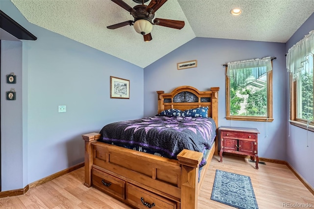 5362 S Danube Ct, Centennial, CO 80015 - bedroom featuring a textured ceiling, vaulted ceiling, light wood finished floors, and a ceiling fan