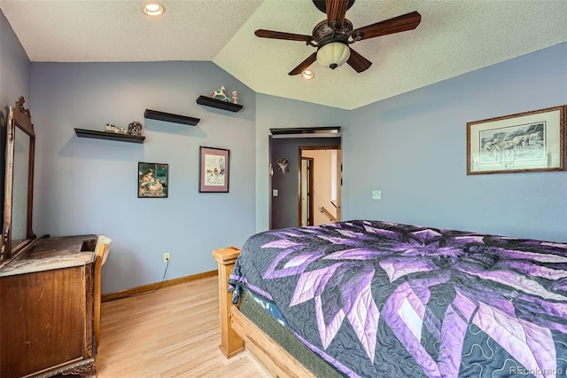 5362 S Danube Ct, Centennial, CO 80015 - bedroom with light wood finished floors, lofted ceiling, a textured ceiling, and a ceiling fan