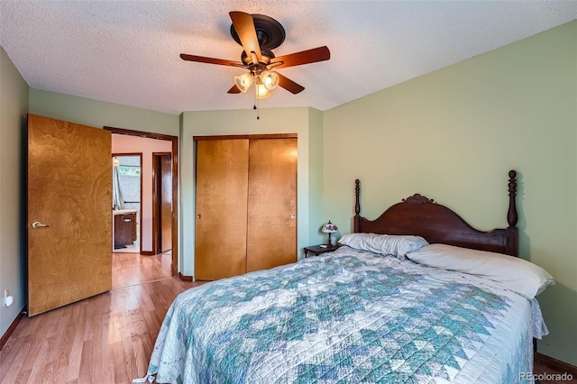 5362 S Danube Ct, Centennial, CO 80015 - bedroom featuring wood finished floors, a closet, ceiling fan, and a textured ceiling