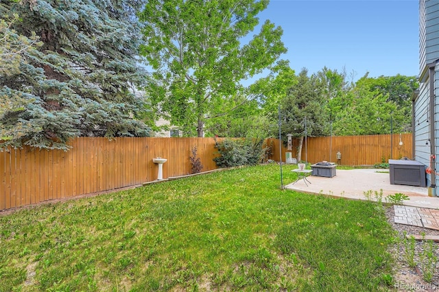 5362 S Danube Ct, Centennial, CO 80015 - fenced backyard with a patio area and a fire pit