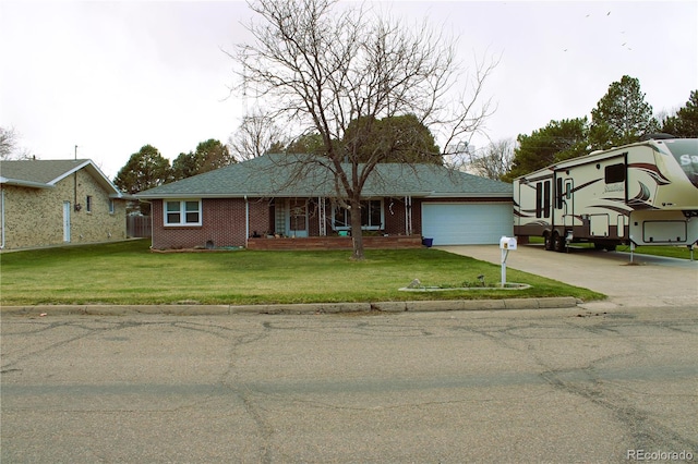 view of front facade featuring a front yard and a garage