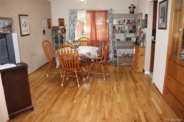 dining space featuring light wood-type flooring