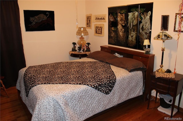 bedroom featuring dark wood-type flooring