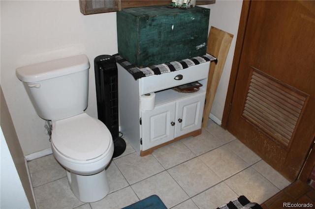 bathroom with tile floors and toilet