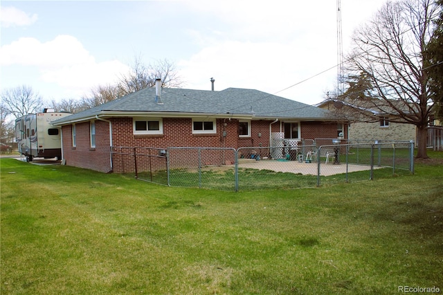 rear view of property with a patio area and a yard