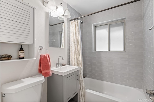 full bathroom with vanity, shower / bath combo, and toilet