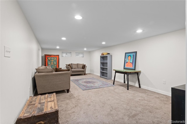 living room featuring recessed lighting, baseboards, and carpet