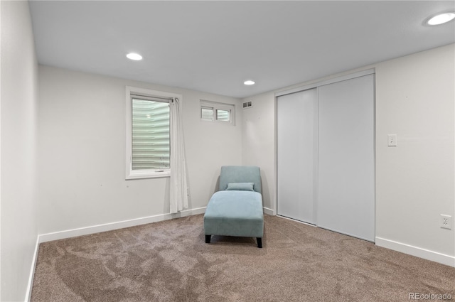 sitting room featuring baseboards, carpet flooring, visible vents, and recessed lighting