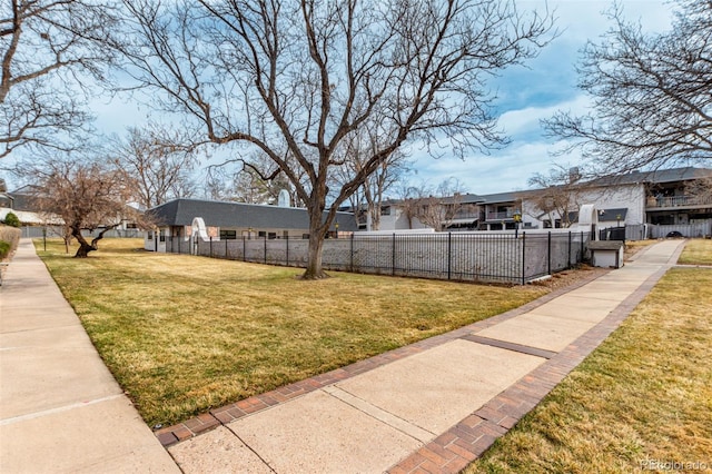 view of yard featuring a residential view and fence