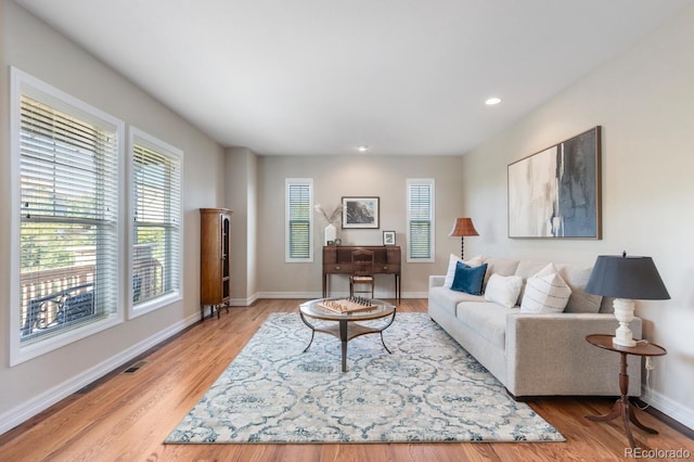 1519 Stonehill Ct, Castle Rock, CO 80104 - living area featuring plenty of natural light, light wood finished floors, baseboards, and recessed lighting