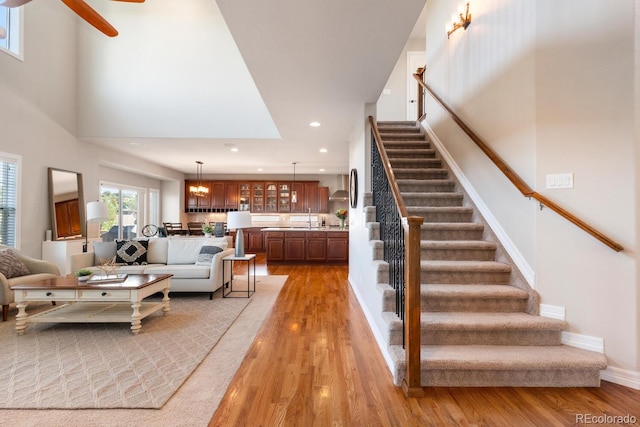 1519 Stonehill Ct, Castle Rock, CO 80104 - living room with light wood-type flooring, stairs, a ceiling fan, recessed lighting, and baseboards