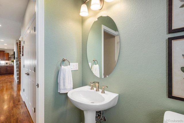 1519 Stonehill Ct, Castle Rock, CO 80104 - bathroom with wood finished floors, a sink, recessed lighting, and a textured wall