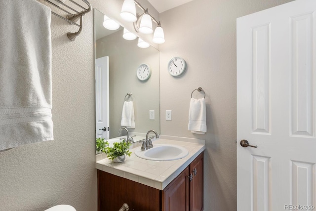 1519 Stonehill Ct, Castle Rock, CO 80104 - bathroom with vanity and a textured wall