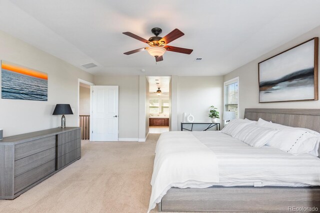 1519 Stonehill Ct, Castle Rock, CO 80104 - bedroom featuring light colored carpet, baseboards, connected bathroom, and ceiling fan