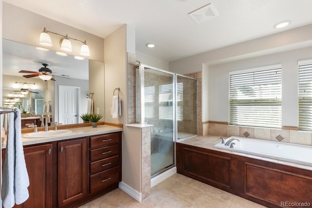 1519 Stonehill Ct, Castle Rock, CO 80104 - full bathroom featuring a shower stall, vanity, ceiling fan, a garden tub, and tile patterned floors