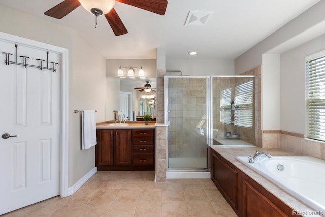 1519 Stonehill Ct, Castle Rock, CO 80104 - full bathroom with ceiling fan, a shower stall, vanity, tile patterned floors, and a bath