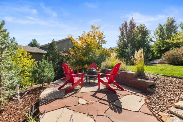 1519 Stonehill Ct, Castle Rock, CO 80104 - view of patio with an outdoor fire pit