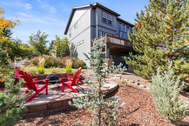 1519 Stonehill Ct, Castle Rock, CO 80104 - back of property featuring a fire pit and a patio