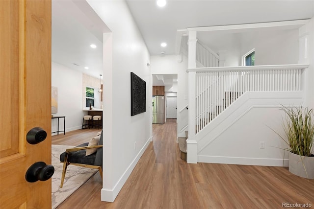 2849 N Vine St, Denver, CO 80205 - corridor featuring wood finished floors, recessed lighting, and stairway
