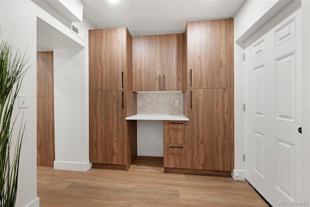 2849 N Vine St, Denver, CO 80205 - hallway with light wood-style floors and baseboards
