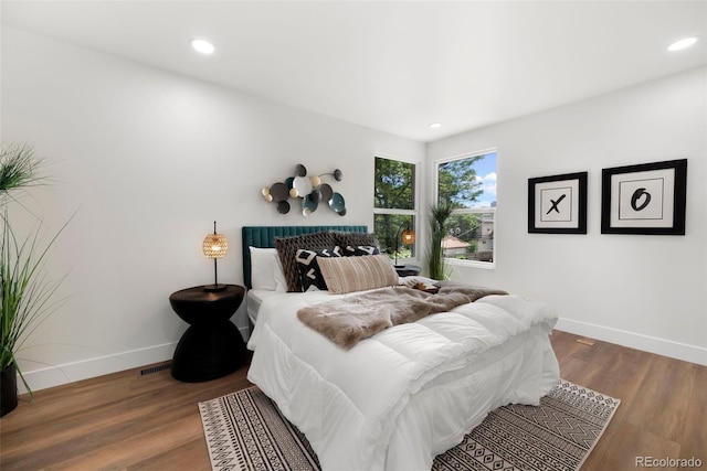 2849 N Vine St, Denver, CO 80205 - bedroom featuring wood finished floors and recessed lighting