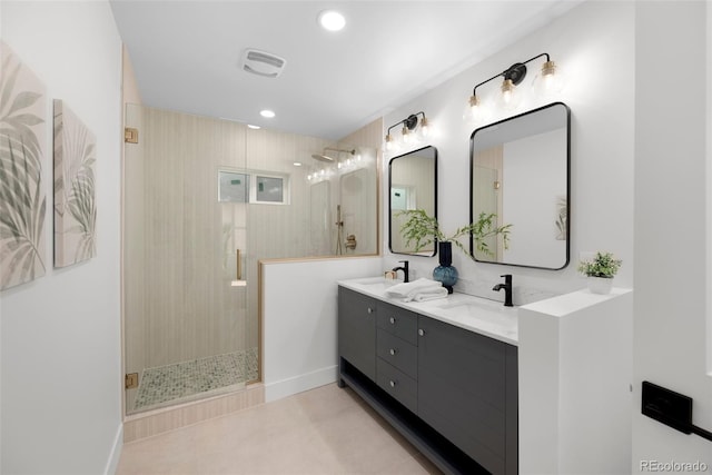 2849 N Vine St, Denver, CO 80205 - bathroom with double vanity, a stall shower, recessed lighting, and tile patterned floors