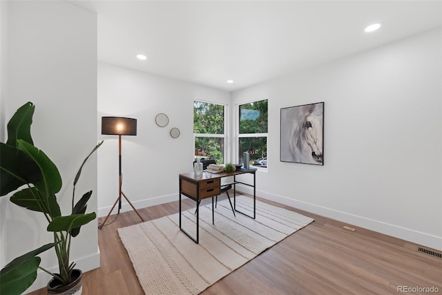 2849 N Vine St, Denver, CO 80205 - home office with light wood finished floors and recessed lighting