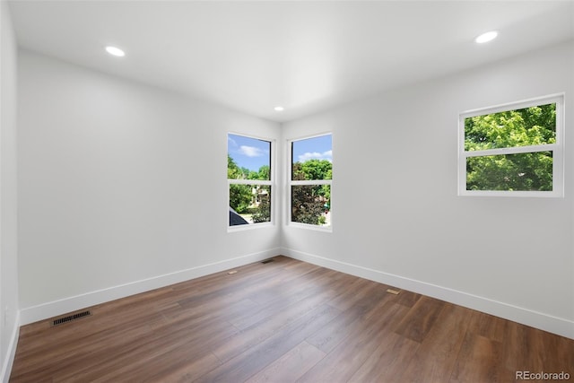 2849 N Vine St, Denver, CO 80205 - unfurnished room with wood finished floors and recessed lighting