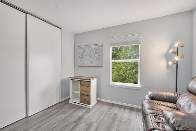 9519 W Coal Mine Ave Unit F, Littleton, CO 80123 - living area with light wood-style floors and baseboards